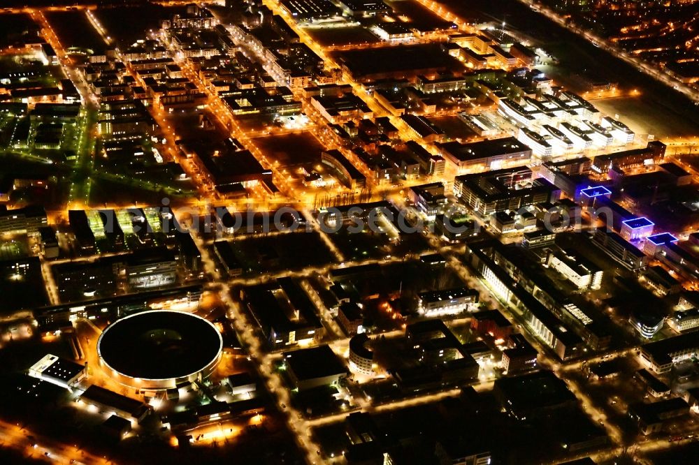 Aerial photograph at night Berlin - Night lighting research building and office complex Elektronen- Speicherring BESSY - Synchrotronstrahlungsquelle in the district Adlershof in Berlin, Germany