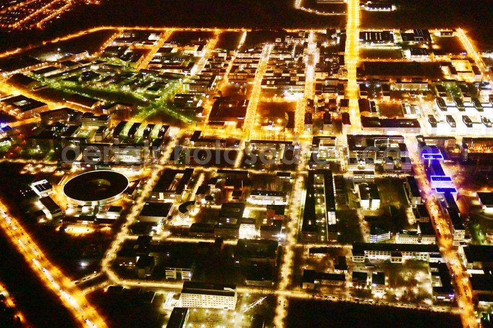 Aerial photograph at night Berlin - Night lighting research building and office complex Elektronen- Speicherring BESSY - Synchrotronstrahlungsquelle in the district Adlershof in Berlin, Germany