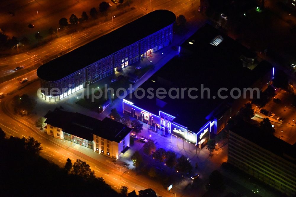 Aerial image at night Neubrandenburg - Night lighting Building of the cinema - movie theater Cine Star on Friedrich-Engels-Ring in Neubrandenburg in the state Mecklenburg - Western Pomerania, Germany