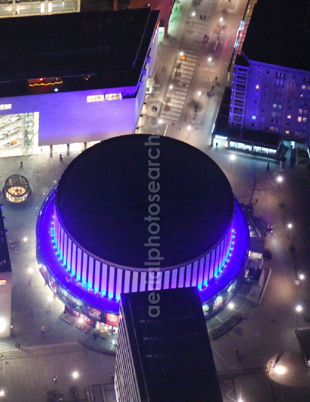 Aerial image at night Dresden - Night lights and lighting Building of the round cinema - Rundkino Dresden. The rotunda is located on the Prager Strasse in the district Altstadt in Dresden in the federal state of Saxony, Germany