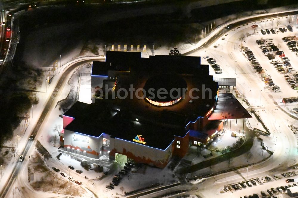 Aerial photograph at night Wildau - Night view wintry snowy Building of the cinema - movie theater A10 Freizeitwelt und CineStar Cinemain Wildau in the state Brandenburg