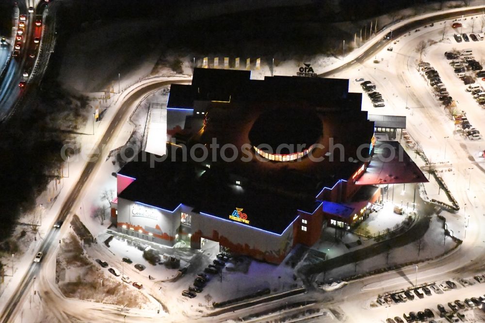 Wildau at night from above - Night view wintry snowy Building of the cinema - movie theater A10 Freizeitwelt und CineStar Cinemain Wildau in the state Brandenburg