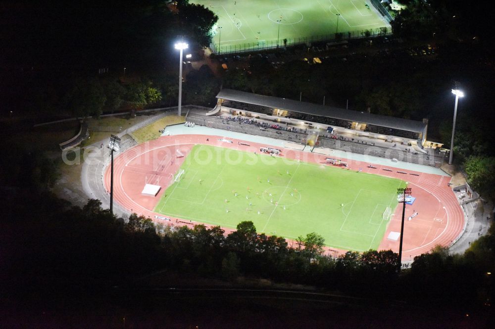 Aerial photograph at night Berlin - Night lighting football stadium of the football club SSC Sport-Club Charlottenburg e.V. in the district Charlottenburg in Berlin, Germany