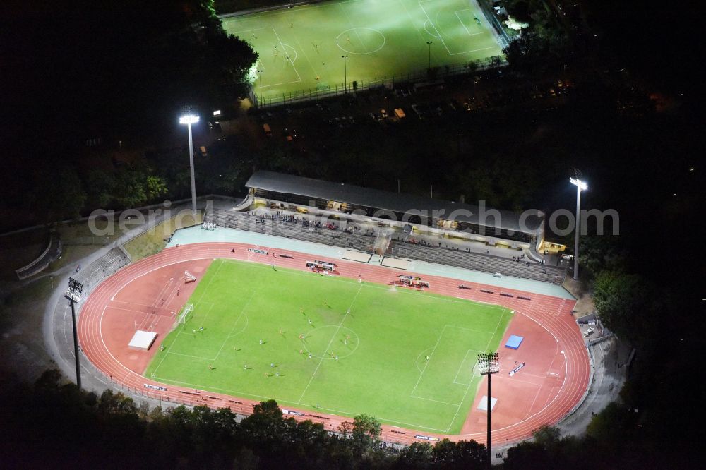 Berlin at night from above - Night lighting football stadium of the football club SSC Sport-Club Charlottenburg e.V. in the district Charlottenburg in Berlin, Germany