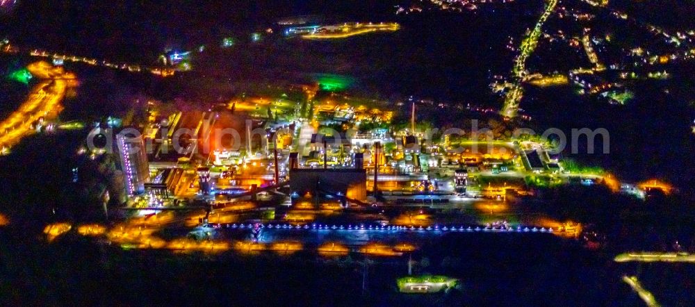 Aerial image at night Bottrop - Night lighting gasometer high storage tank at Kokerei Prosper in Bottrop at Ruhrgebiet in the state North Rhine-Westphalia