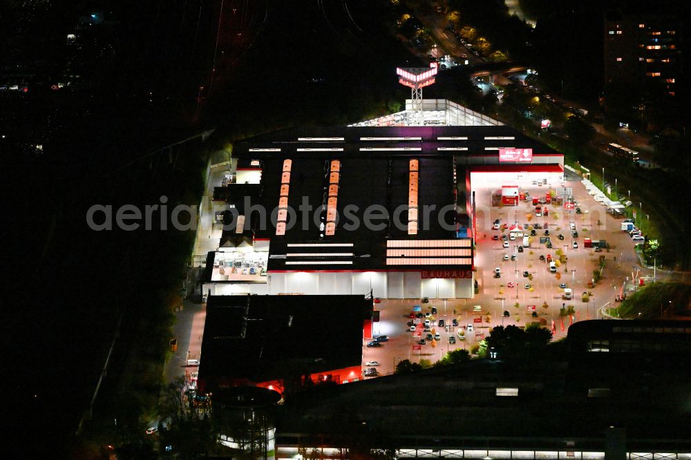 Berlin at night from above - Night lighting building of the construction market Bauhaus Berlin-Spandau on street An den Freiheitswiesen in the district Spandau in Berlin, Germany