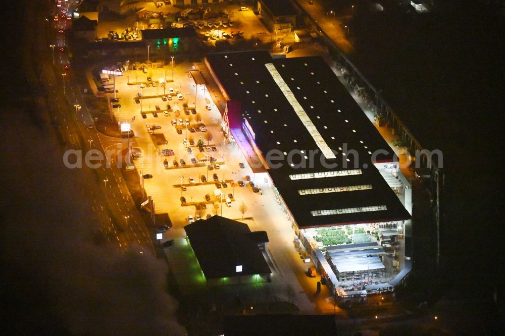 Aerial photograph at night Gera - Night lighting Building of the construction market BAUHAUS on Elsterdonm in Gera in the state Thuringia, Germany