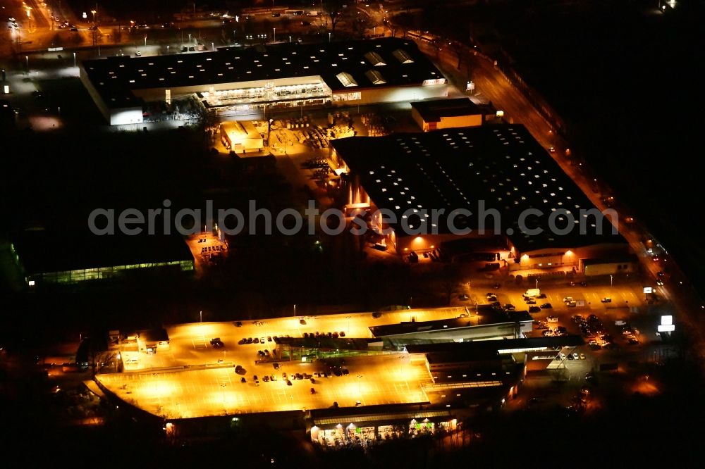 Berlin at night from above - Night lighting building of the construction market on Friedrichshagener Strasse in the district Koepenick in Berlin, Germany