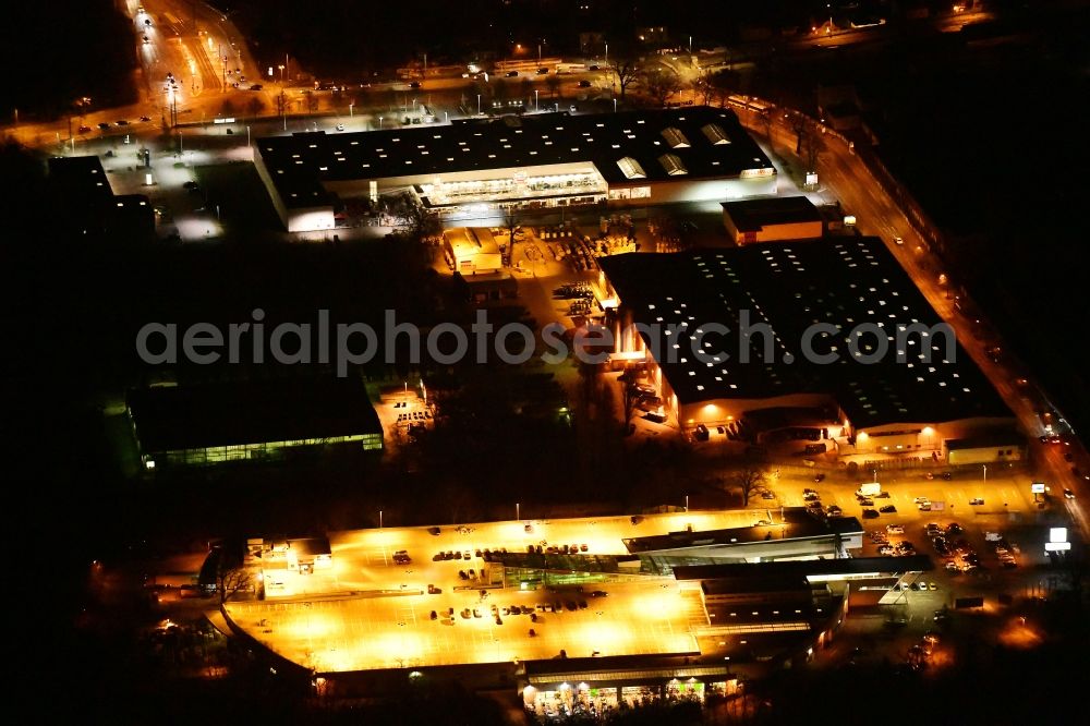 Berlin at night from above - Night lighting building of the construction market on Friedrichshagener Strasse in the district Koepenick in Berlin, Germany