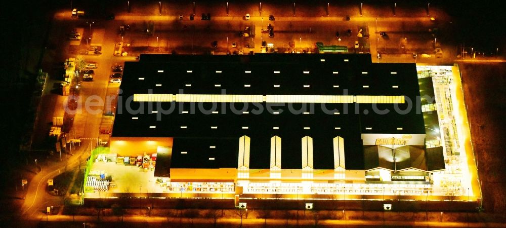 Dresden at night from above - Night lighting building of the construction market Globus Baumarkt Dresden on Raehnitzer Allee in the district Hellerau in Dresden in the state Saxony, Germany