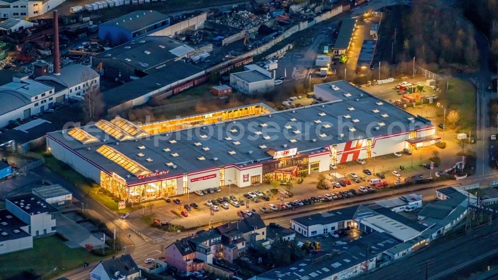 Aerial photograph at night Hamm - Night lighting building of the construction market Hellweg on Oestingstrasse in Hamm in the state North Rhine-Westphalia, Germany