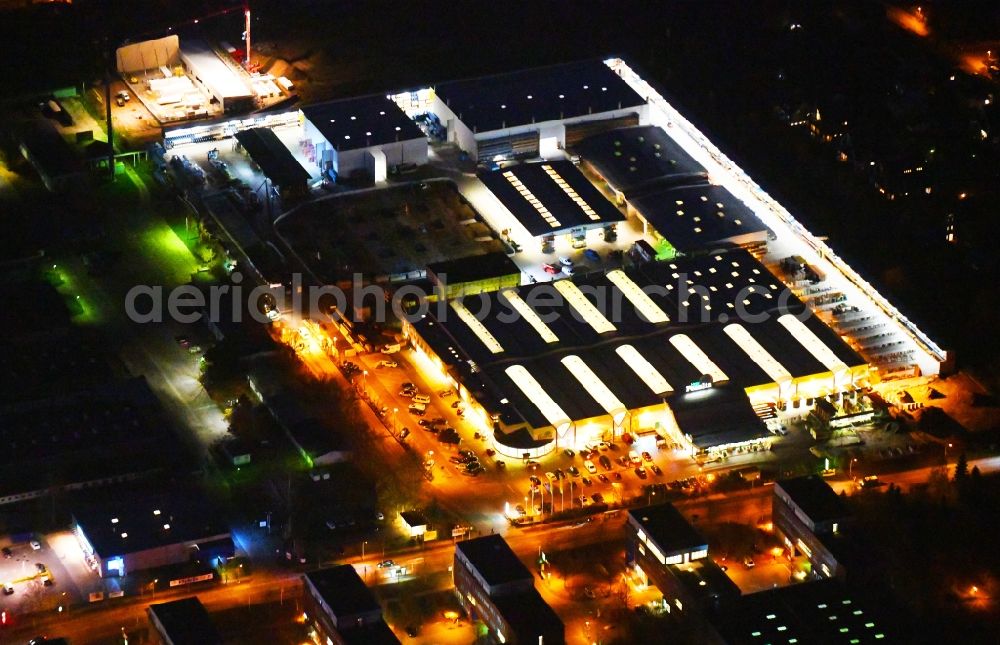 Berlin at night from above - Night lighting Building of the construction market Holz Possling in the district Mahlsdorf in Berlin, Germany