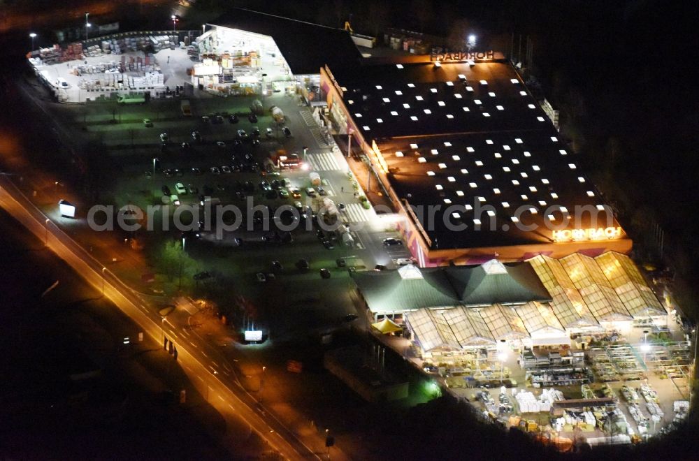 Aerial photograph at night Magdeburg - Night lighting Building of the construction market of Hornbach on Silberbergweg in the district Grosser Silberberg in Magdeburg in the state Saxony-Anhalt