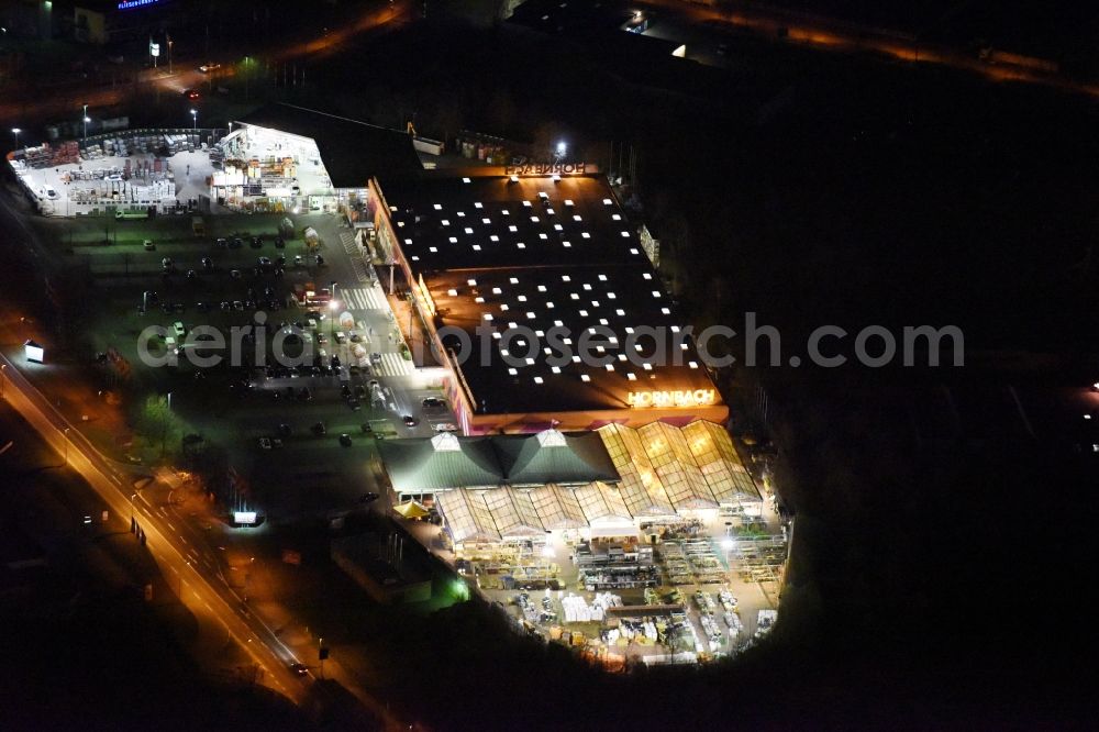 Aerial image at night Magdeburg - Night lighting Building of the construction market of Hornbach on Silberbergweg in the district Grosser Silberberg in Magdeburg in the state Saxony-Anhalt