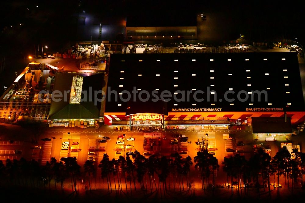 Aerial image at night Velten - Night lighting building of the construction market HORNBACH Velten on Parkallee in Velten in the state Brandenburg, Germany