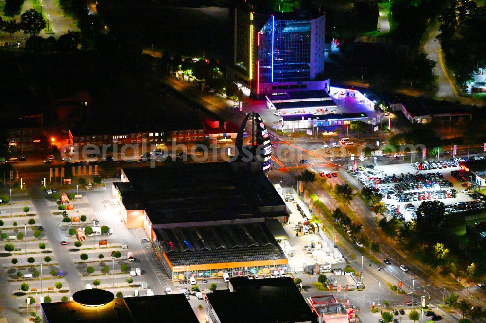 Berlin at night from above - Night lighting building of the construction market OBI on street Nonnendammallee in the district Siemensstadt in Berlin, Germany