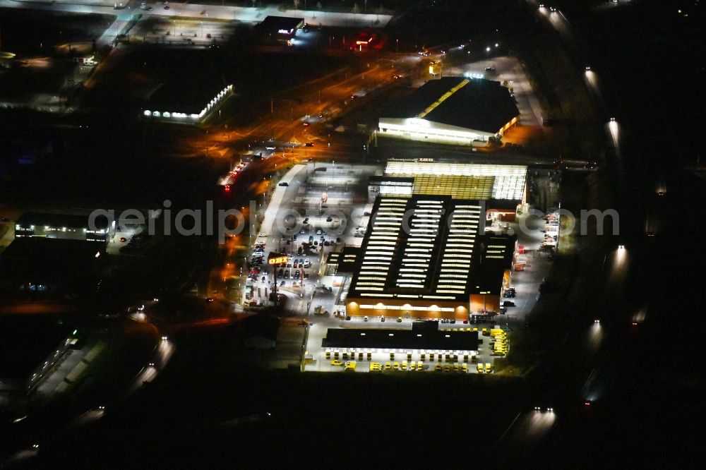 Aerial image at night Forchheim - Night lighting Building of the construction market OBI in Forchheim in the state Bavaria, Germany