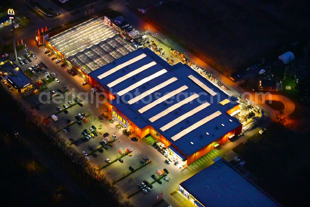 Bernau at night from above - Night lighting building of the construction market OBI on J.-F.-A Johann-Friedrich-A.-Borsig-Strasse in Bernau in the state Brandenburg, Germany