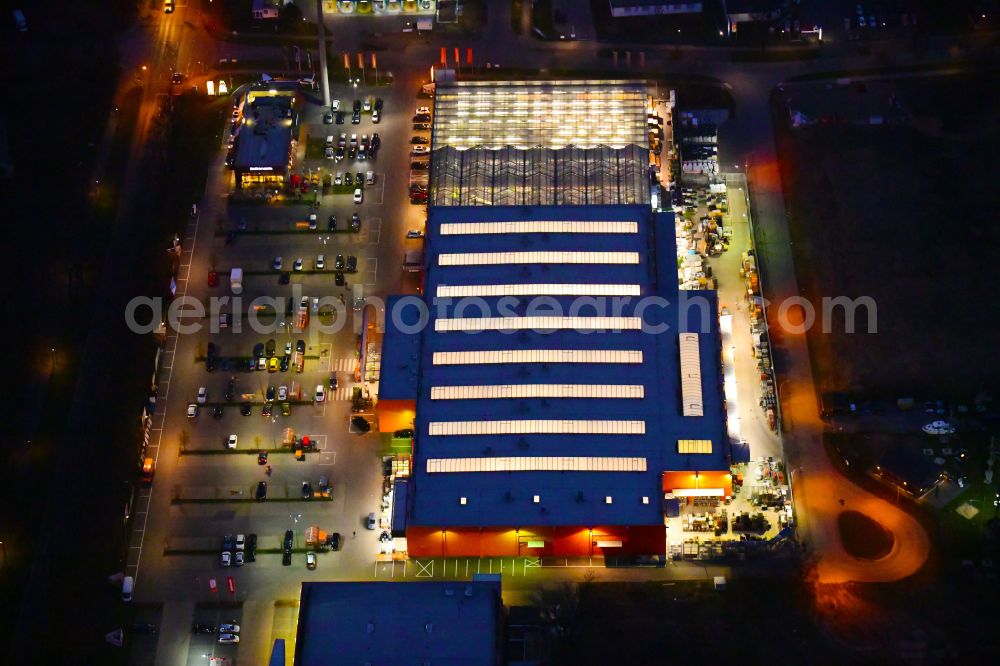 Aerial photograph at night Bernau - Night lighting building of the construction market OBI on J.-F.-A Johann-Friedrich-A.-Borsig-Strasse in Bernau in the state Brandenburg, Germany