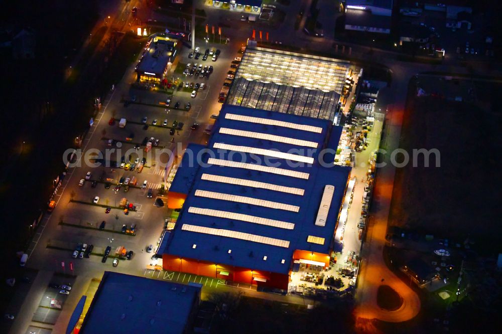 Bernau at night from above - Night lighting building of the construction market OBI on J.-F.-A Johann-Friedrich-A.-Borsig-Strasse in Bernau in the state Brandenburg, Germany