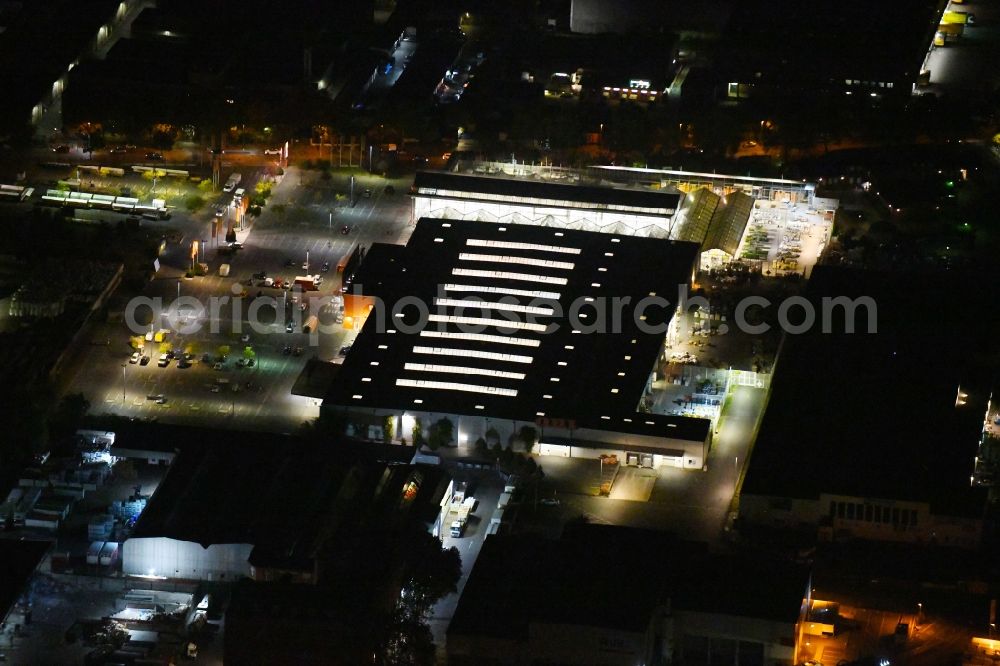 Berlin at night from above - Night lighting Building of the construction market OBI Markt Berlin-Neukoelln in the district Neukoelln in Berlin, Germany