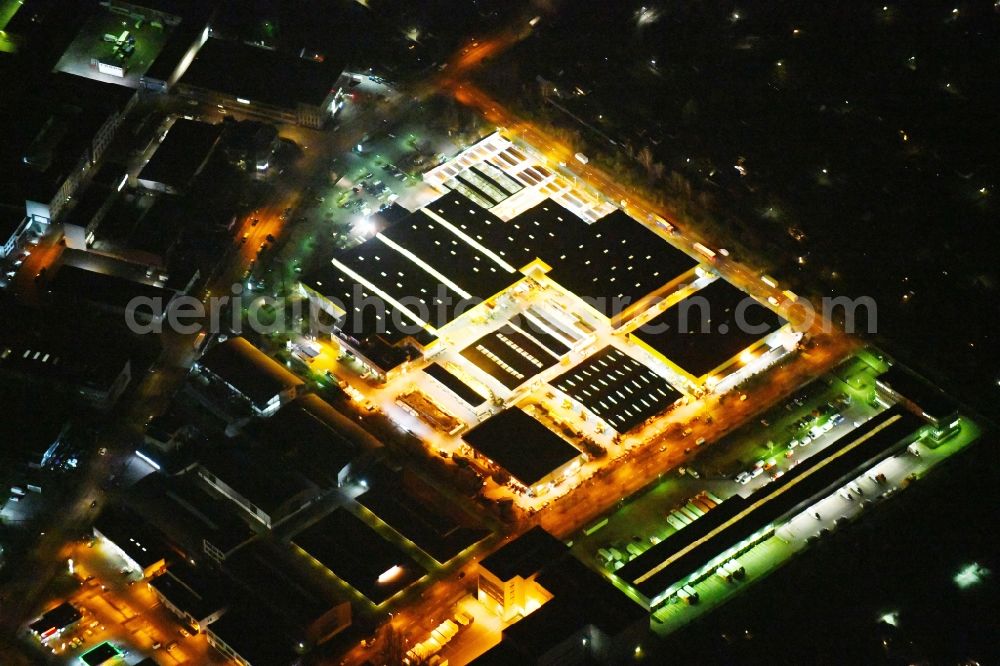 Aerial image at night Berlin - Night lighting Building of the construction market Possling GmbH & Co. KG on Adam-von-Trott-Strasse in the district Charlottenburg in Berlin, Germany