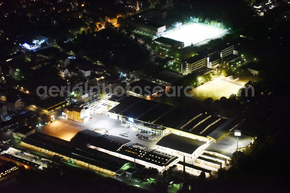 Berlin at night from above - Night view building of the construction market of Possling GmbH & Co.KG Britz an der Haarlemer Strasse in Berlin