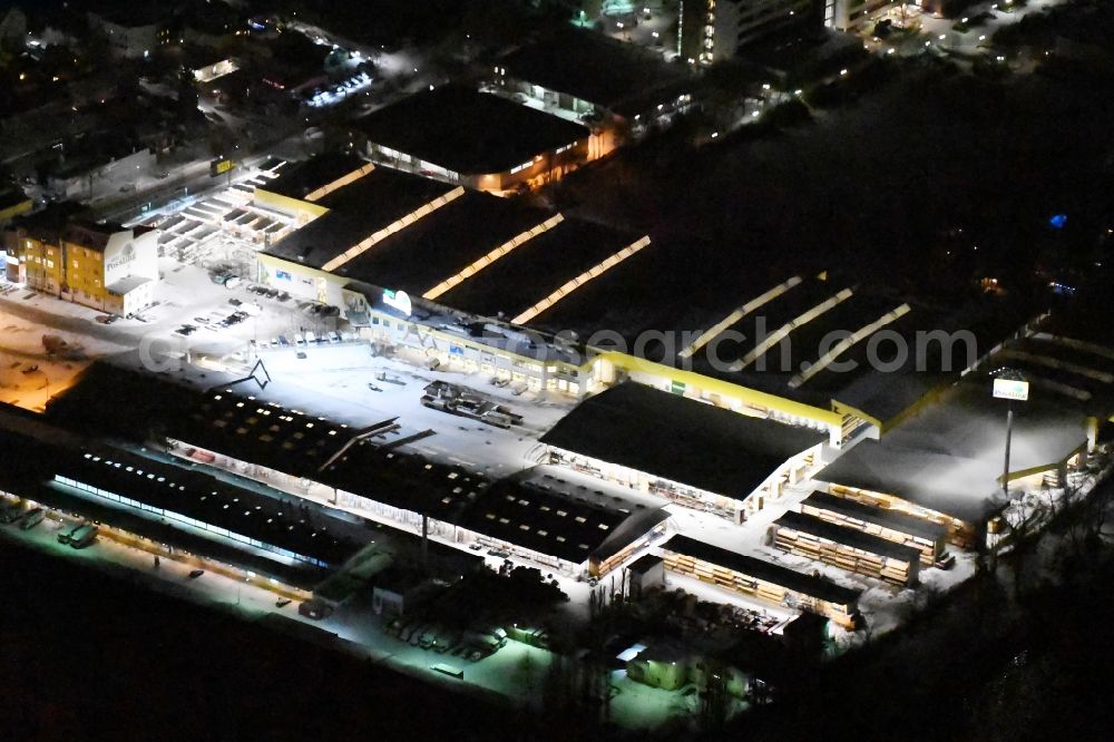 Berlin at night from above - Nigt view building of the construction market of Possling GmbH & Co.KG Britz Haarlemer Strasse in the district Britz in Berlin