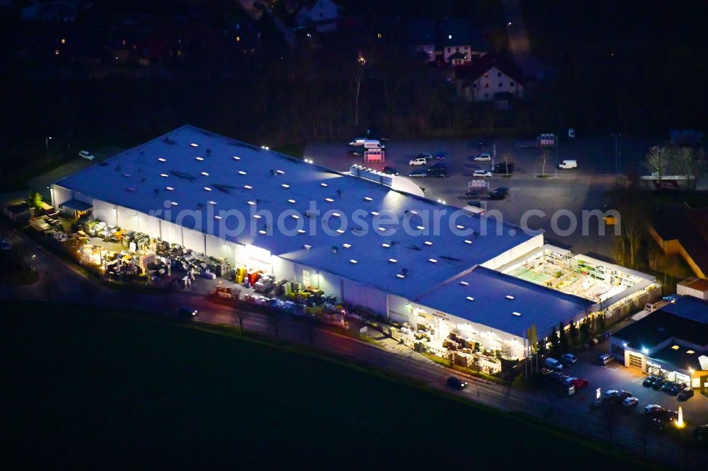 Aerial photograph at night Bernau - Night lighting building of the construction market toom Baumarkt in Bernau in the state Brandenburg, Germany