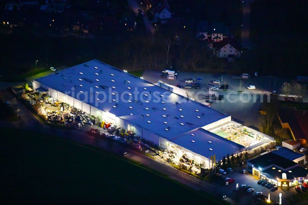 Aerial image at night Bernau - Night lighting building of the construction market toom Baumarkt in Bernau in the state Brandenburg, Germany