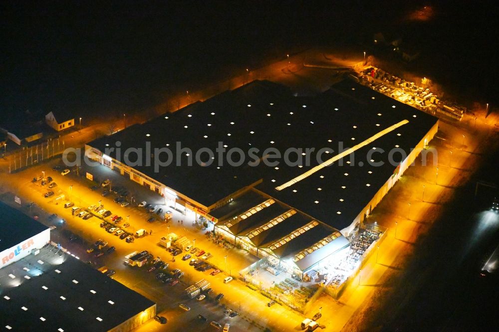 Fürstenwalde/Spree at night from above - Night lighting Building of the construction market toom on Alte Langewahler Chaussee in Fuerstenwalde/Spree in the state Brandenburg, Germany