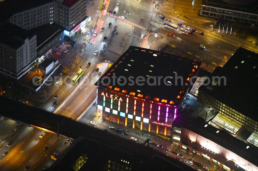 Aerial photograph at night Berlin - Night lighting Building of the shopping center Alexa on Grunerstrasse in Berlin, Germany