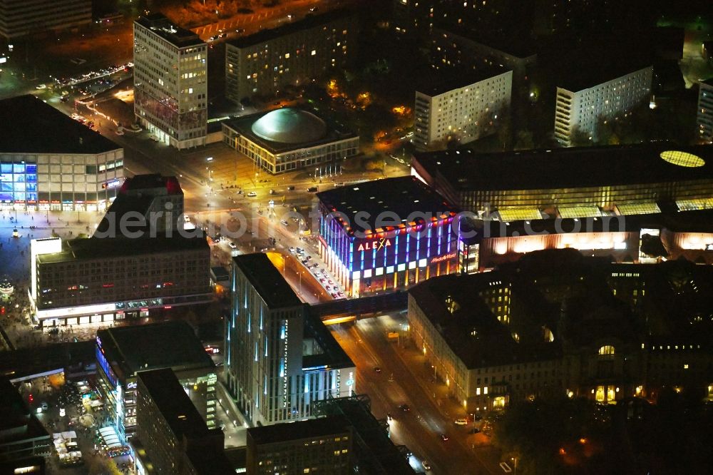 Aerial photograph at night Berlin - Night lighting Building of the shopping center Alexa on Grunerstrasse in Berlin, Germany