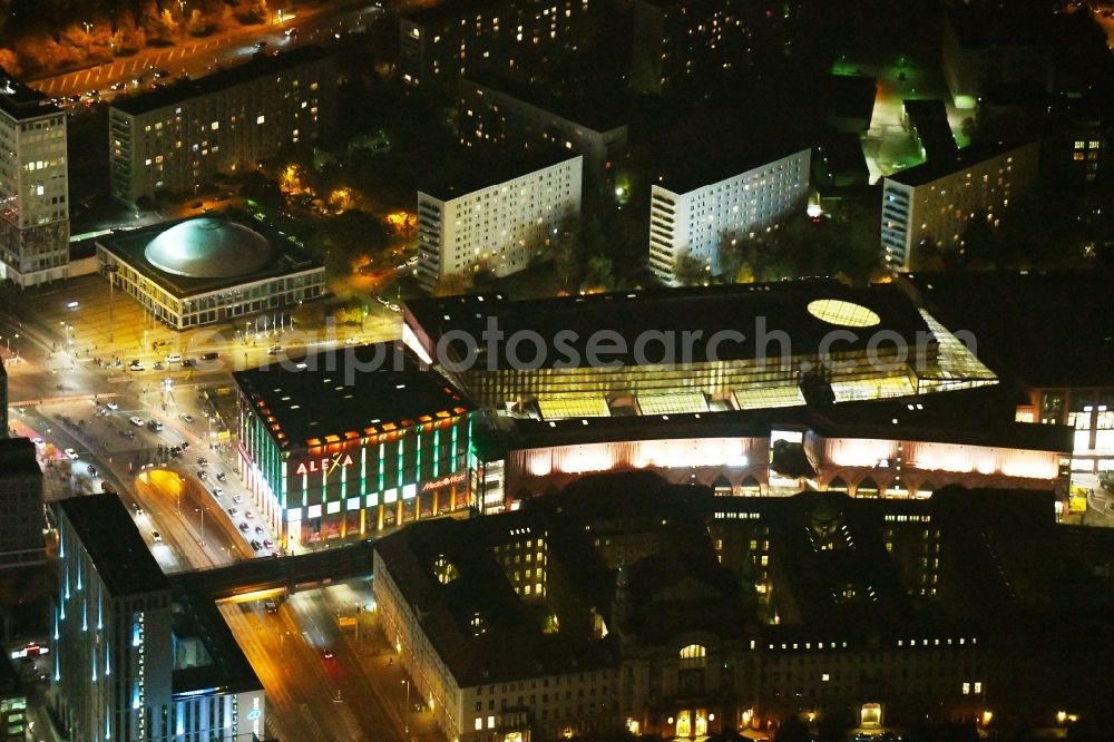 Aerial image at night Berlin - Night lighting Building of the shopping center Alexa on Grunerstrasse in Berlin, Germany