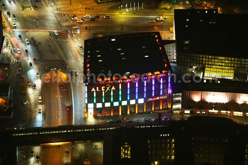 Aerial photograph at night Berlin - Night lighting Building of the shopping center Alexa on Grunerstrasse in Berlin, Germany