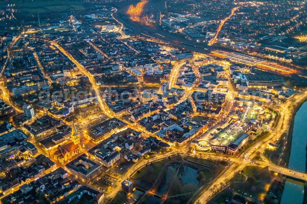 Aerial image at night Hamm - Night lighting building of the shopping center Allee-Center of the ECE projectmanagement with parking level in Hamm in the state North Rhine-Westphalia. In the picture as well the Ritter Passage