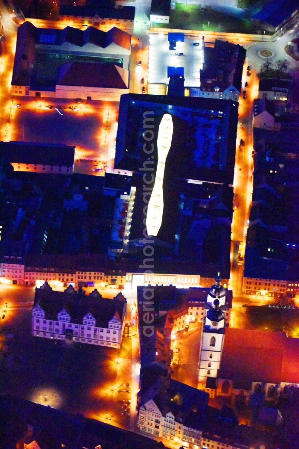 Aerial photograph at night Lutherstadt Wittenberg - Night lighting Building of the shopping center ARSENAL in Lutherstadt Wittenberg in the state Saxony-Anhalt