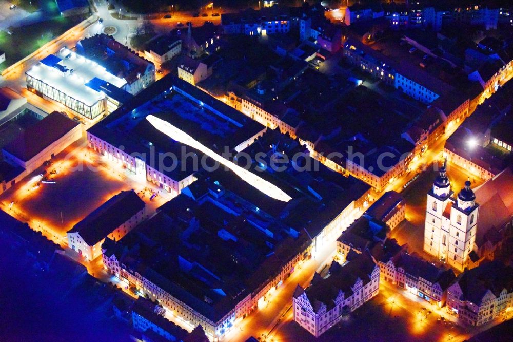 Aerial image at night Lutherstadt Wittenberg - Night lighting Building of the shopping center ARSENAL in Lutherstadt Wittenberg in the state Saxony-Anhalt