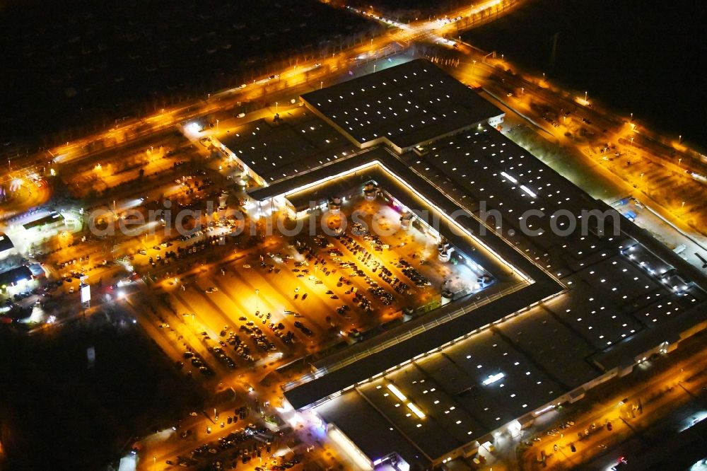 Aerial image at night Magdeburg - Night lighting building of the shopping center Florapark on Olvenstedter Graseweg in Magdeburg in the state Saxony-Anhalt