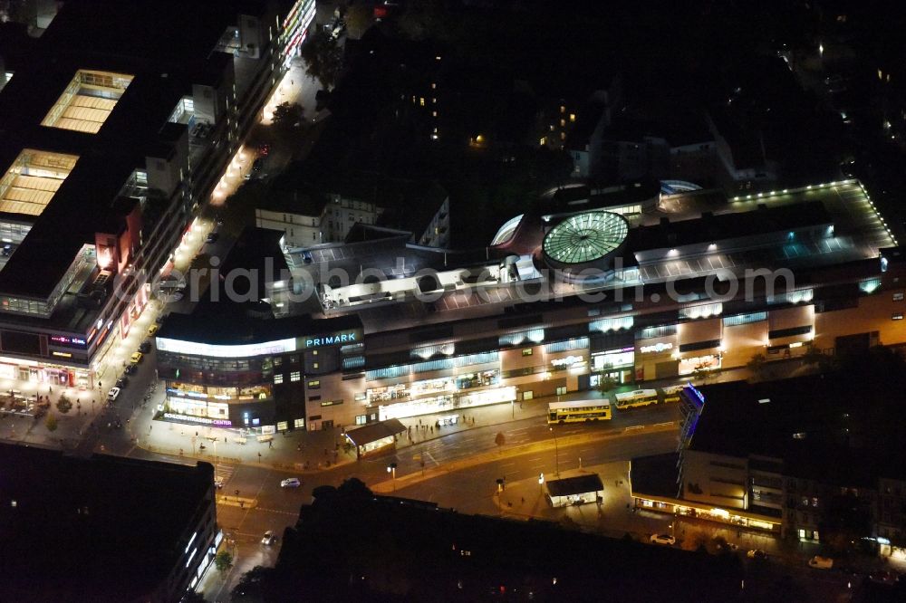 Aerial image at night Berlin - Night view Building of the shopping center Forum Steglitz on Schlossallee in Berlin