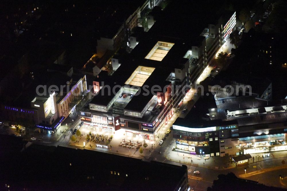 Berlin at night from the bird perspective: Night view Building of the shopping center Forum Steglitz on Schlossallee in Berlin