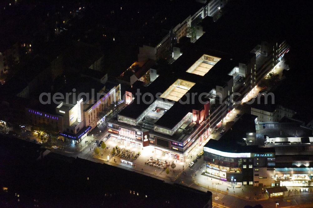 Aerial image at night Berlin - Night view Building of the shopping center Forum Steglitz on Schlossallee in Berlin