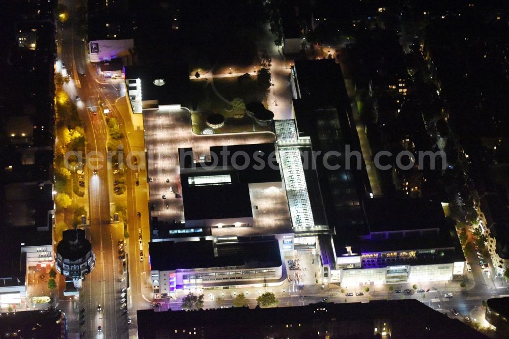 Berlin at night from the bird perspective: Night view Building of the shopping center Forum Steglitz on Schlossallee in Berlin