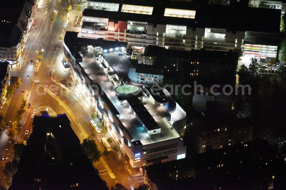 Aerial image at night Berlin - Night view Building of the shopping center Forum Steglitz on Schlossallee in Berlin