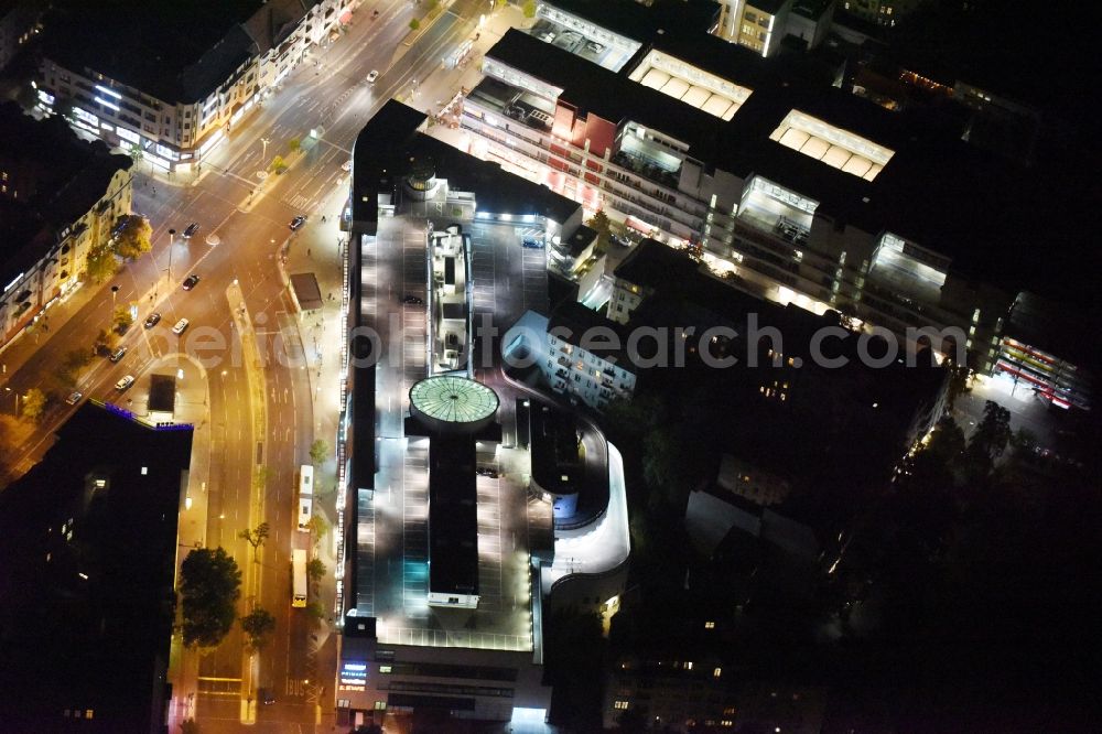 Berlin at night from the bird perspective: Night view Building of the shopping center Forum Steglitz on Schlossallee in Berlin