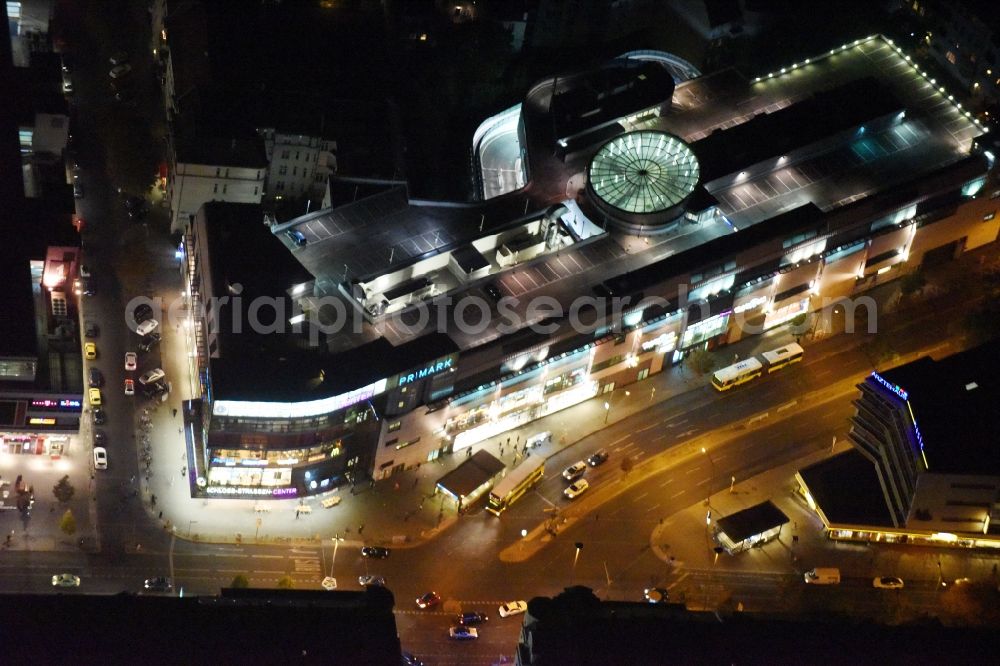 Aerial image at night Berlin - Night view Building of the shopping center Forum Steglitz on Schlossallee in Berlin