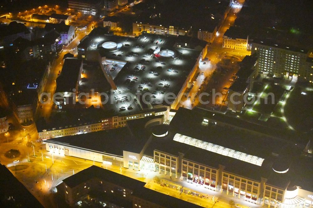 Aerial image at night Gera - Night lighting Building of the shopping center Gera Arcaden on Heinrichstrasse in Gera in the state Thuringia, Germany