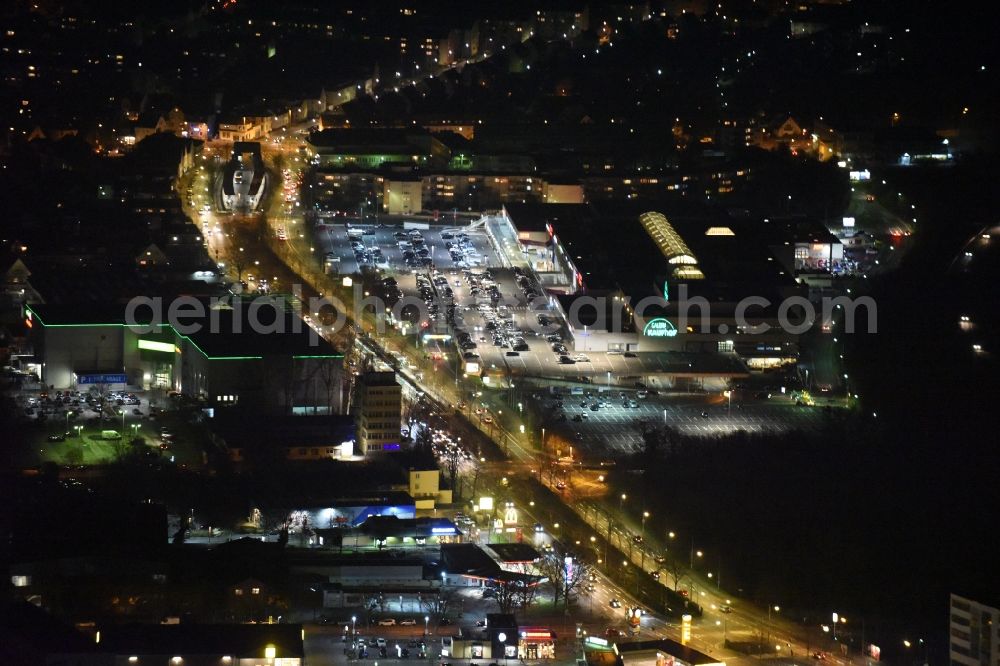 Aerial image at night Frankfurt am Main - Night view Building of the shopping center Hessen-Center of ECE Projektmanagement GmbH & Co. KG an der Borsigallee in Frankfurt in the state Hesse