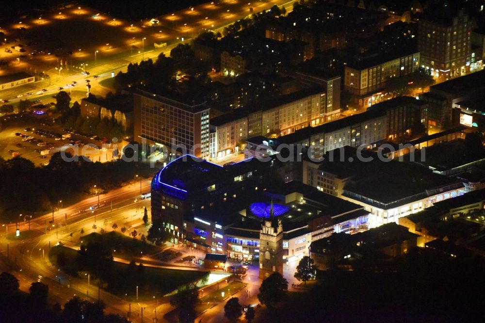 Aerial photograph at night Rostock - Night lighting Building of the shopping center Kroepeliner Tor Center in Rostock in the state Mecklenburg - Western Pomerania, Germany