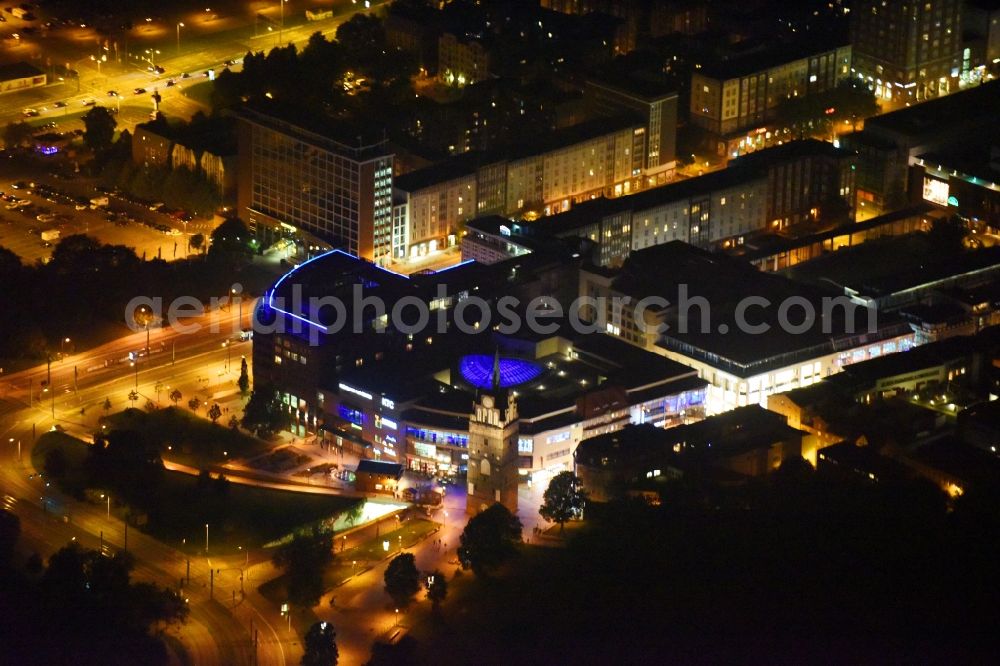 Aerial image at night Rostock - Night lighting Building of the shopping center Kroepeliner Tor Center in Rostock in the state Mecklenburg - Western Pomerania, Germany